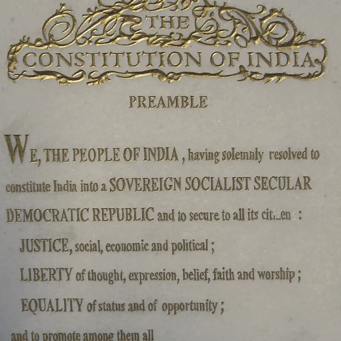 The Preamble to the Constitution of India in gilded lettering